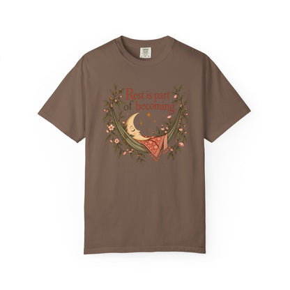 Rest Is Part of Becoming T-Shirt — Relaxation Graphic Tee with Hammock and Floral Design